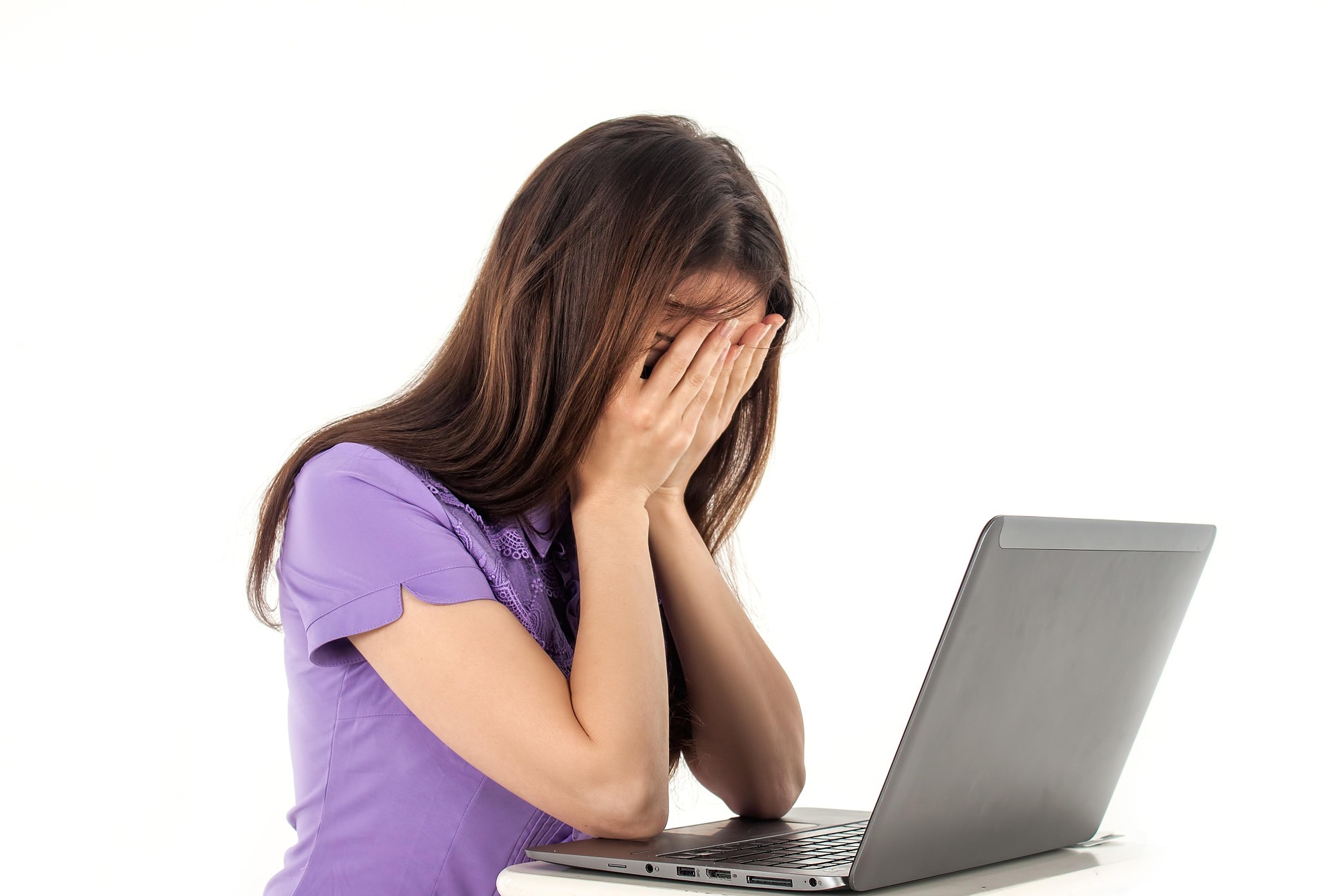 Stressed person in front of a computer Stressed person in front of a computer